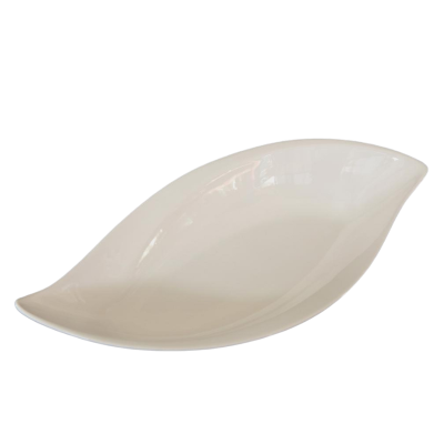 A white ceramic leaf-shaped bowl.