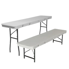 Two long, narrow, white tables, one with high legs and one with short legs.