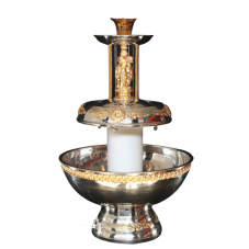 An ornate silver and gold beverage fountain.