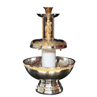 An ornate silver and gold beverage fountain.