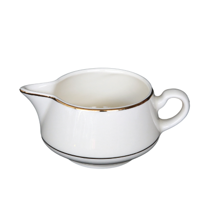 A creamer with decorative gold rings on and near the edge.