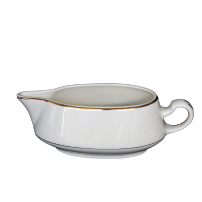 A gravy boat with with a decorative gold ring around the rim and handle.