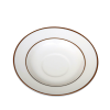 A saucer with decorative gold rings on and near the edge
