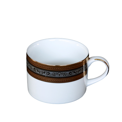 A coffee cup with metallic gold and silver rings around the rim and accents on the handle.