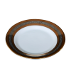 A salad plate with metallic gold and silver rings around the outer edge.