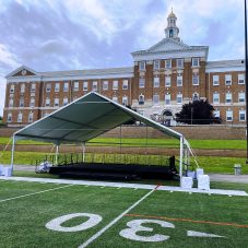 frame tent to cover stage with open front