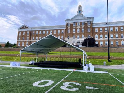 frame tent to cover stage with open front