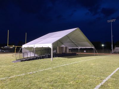 tent to cover stage with open front