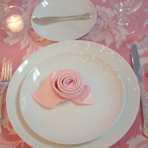 pink linen place setting