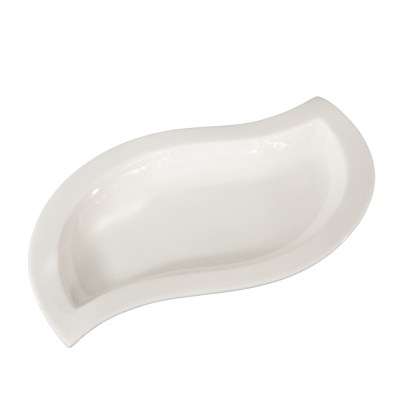 A white ceramic tilde-shaped bowl.