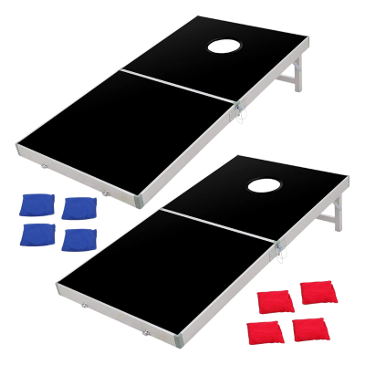 Two black fold up boards with two sets of red and blue bean bags for cornhole.