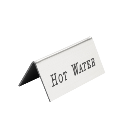 A silver colored beverage tent that reads "Hot Water".