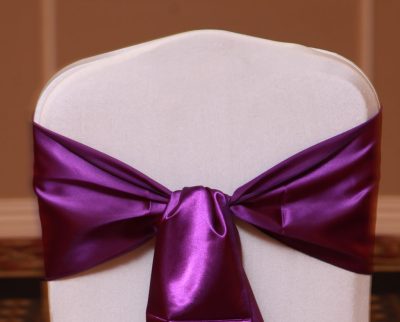 purple satin sash linen rental