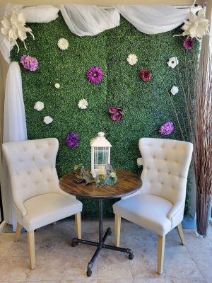 boxwood backdrop with decorations