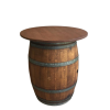 A wine barrel with a table top on top of it.