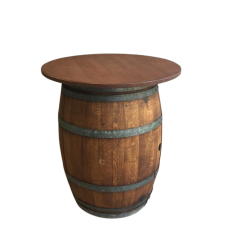 A wine barrel with a table top on top of it.