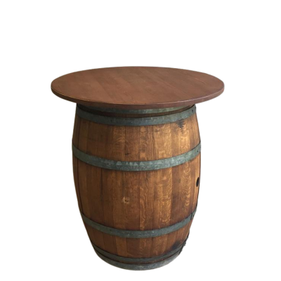 A wine barrel with a table top on top of it.