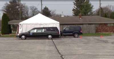drive thru tent for viewing of casket
