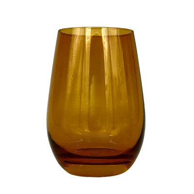 An amber stemless wine glass.