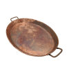 An oval shaped 12 by 18 inch antique copper tray with handles.