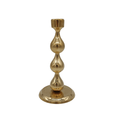 A 6 inch tall candlestick with teardrop-shaped segments in the center.