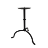 A 10 inch black wrought iron candlestick with a three-legged base.