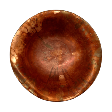 A fluted copper bowl viewed from overhead.
