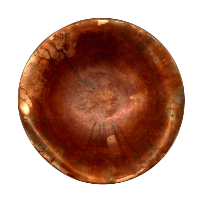 A fluted copper bowl viewed from overhead.