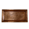 A rectangular copper tray with a hammered texture.