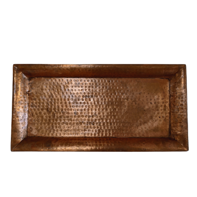 A rectangular copper tray with a hammered texture.