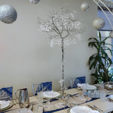 Silver Crystal Tree Centerpiece on a set table.