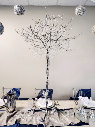 Silver Crystal Tree Centerpiece on a set table.