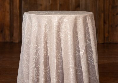 Hi-top table at a wedding with Aria linens
