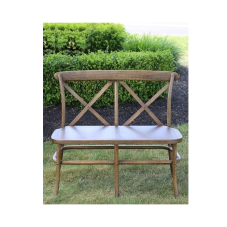 An unpadded rental bench in the rustic farm style for seating two, natural brown color with x-crossed backing.