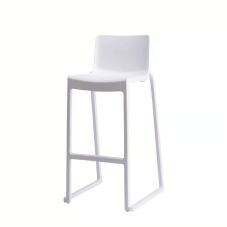 A white rental barstool with a modern, slightly sculpted one-piece design.